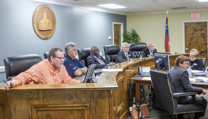 The Coweta County Commission. Pictured, from left, are commissioners Rodney Brooks and Tim Lassetter, Chairman Al Smith, and commissioners Paul Poole and Bob Blackburn. Photo/Ben Nelms.