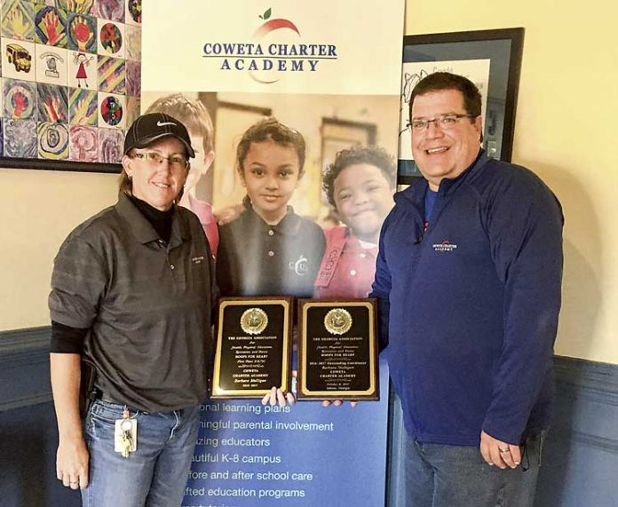 The America Heart Association named the Coweta Charter Academy at Senoia No. 1 in the state again this year for its “Hoops for Heart” fundraising campaign. Pictured, from left, are coach Barbara Mulligan and Principal Gene Dunn. Photo/Submitted.