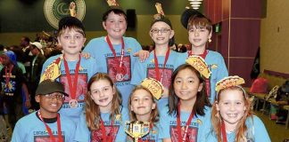 Members of team TACO show off the First Lego League state championship trophy they received for their innovative solution to filling water bottles at drinking fountains. Photo/Fayette School System.
