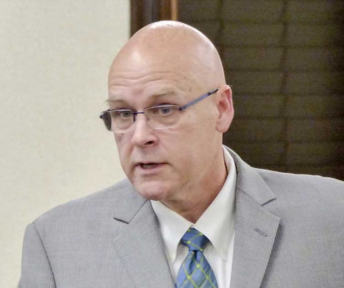 Retired U.S. Army Col. Edward “Edge” Gibbons speaks during public comments at the Feb. 15 meeting of the Peachtree City Council. Photo/Ben Nelms.