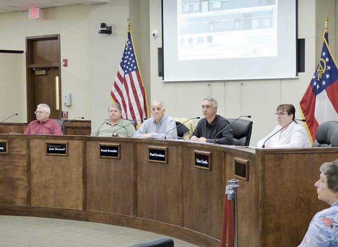 Members of the Peachtree City Planning Commission include, from left, commissioners J.T. Rabun and Jack Bernard, Chairman Frank Destadio, and commissioners Paul Gresham and Lisa Curtis. Photo/Ben Nelms.