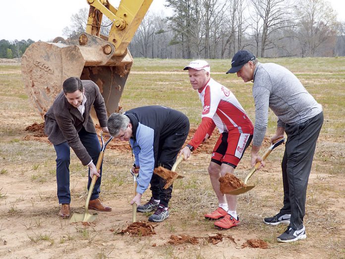 March 16 groundbreaking activities for the Piedmont Wellness Center at Pinewood Forest in Fayetteville included, from left, Pace Lynch Realty co-founder Jason Pace, Piedmont Fayette Hospital CEO Michael Burnett, Pinewood Forest Chief Visionary Dan Cathy and Pinewood Forest President Rob Parker. Photo/Ben Nelms.