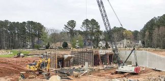 Work on the spillway on Lake Peachtree continues, with substantial completion expected by mid-June. Photo/Ben Nelms.