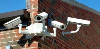 Stock photo of array of school surveillance cameras.
