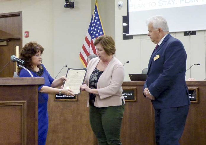Drug Free Fayette representative Jean Felts (C) on April 5 received a proclamation by Peachtree City Mayor Vanessa Fleisch (L) and Councilman Phil Prebor signifying April as Alcohol Awareness Month in Fayette County. Photo/Ben Nelms.