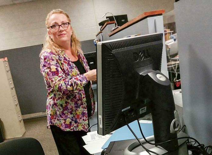 Melissa Hill dressed as an office worker extra on the set of the Sundance drama, “Rectify.” Photo/Submitted.