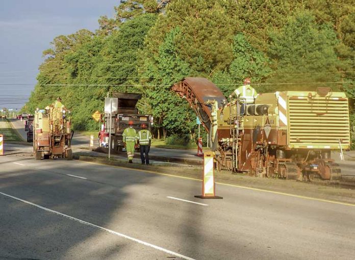 Road crews in the late afternoon sun of May 5 were busy working on left turn lanes on Ga. Highway 54 near the Burch Road intersection. Photo/Ben Nelms.