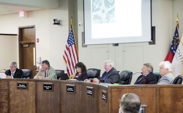 The Peachtree City Council. Pictured, from left, are City Manager Jon Rorie, Councilman Mike King, Mayor Vanessa Fleisch and councilmen Terry Ernst, Kevin Madden and Phil Prebor. Photo/Ben Nelms.