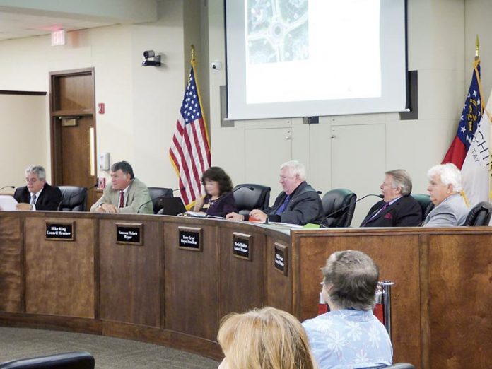 The Peachtree City Council. Pictured, from left, are City Manager Jon Rorie, Councilman Mike King, Mayor Vanessa Fleisch and councilmen Terry Ernst, Kevin Madden and Phil Prebor. Photo/Ben Nelms.