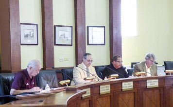 Members of the Fayetteville City Council at the May 30 meeting include, from left, councilmen Harlan Shirley and Paul Oddo, Mayor Ed Johnson and Councilman Rich Hoffman. Photo/Ben Nelms.