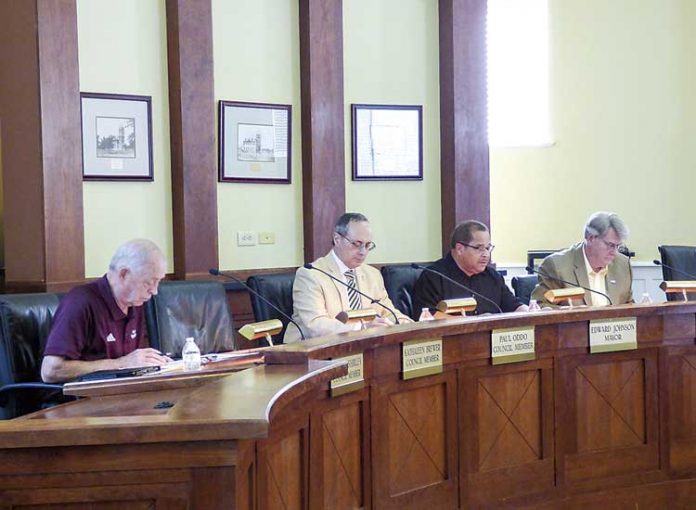 Members of the Fayetteville City Council at the May 30 meeting include, from left, councilmen Harlan Shirley and Paul Oddo, Mayor Ed Johnson and Councilman Rich Hoffman. Photo/Ben Nelms.