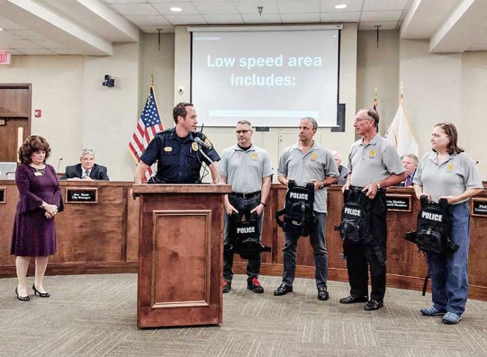 The Peachtree City Auxiliary Police Force recently presented officers with active shooter vests. Pictured, from left, at the presentation were Mayor Vanessa Fleisch, Lt. Brad Williams, auxiliary Capt. John McDonald, auxiliary officers Joe Radest and Fred Dunkelberger and auxiliary Lt. Arline Cuebas. Photo/Submitted.