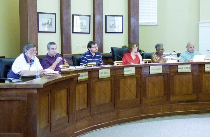 Members of the Fayetteville Planning and Zoning Commission include, from left, commissioners Ken Collins, Toby Spencer, Brett Nolan, Chairman Sarah Murphy and commissioners Debi Renfro and Joe Clark. Photo/Ben Nelms.