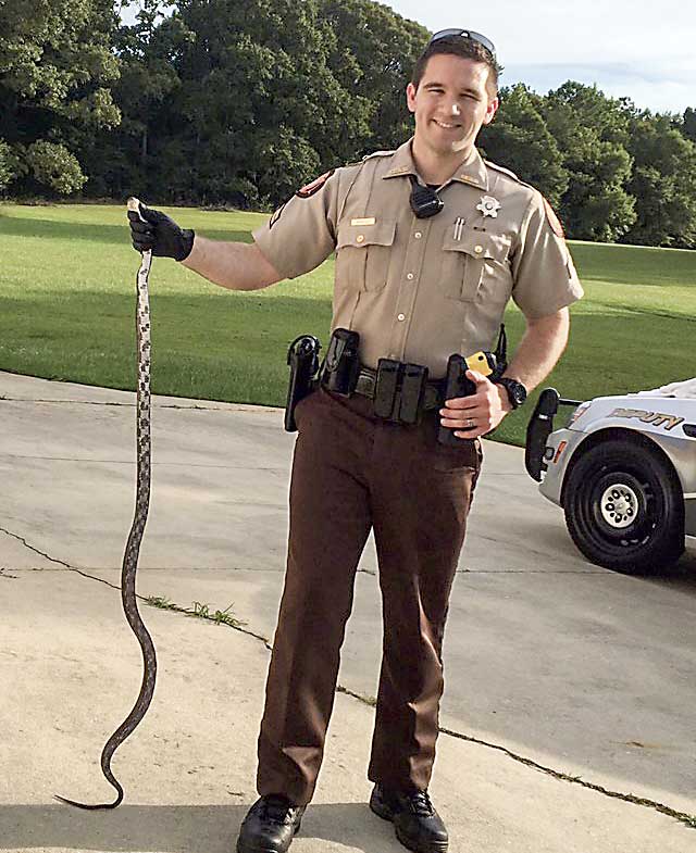 news_071818_snake-wrangler-joseph-bradley_color