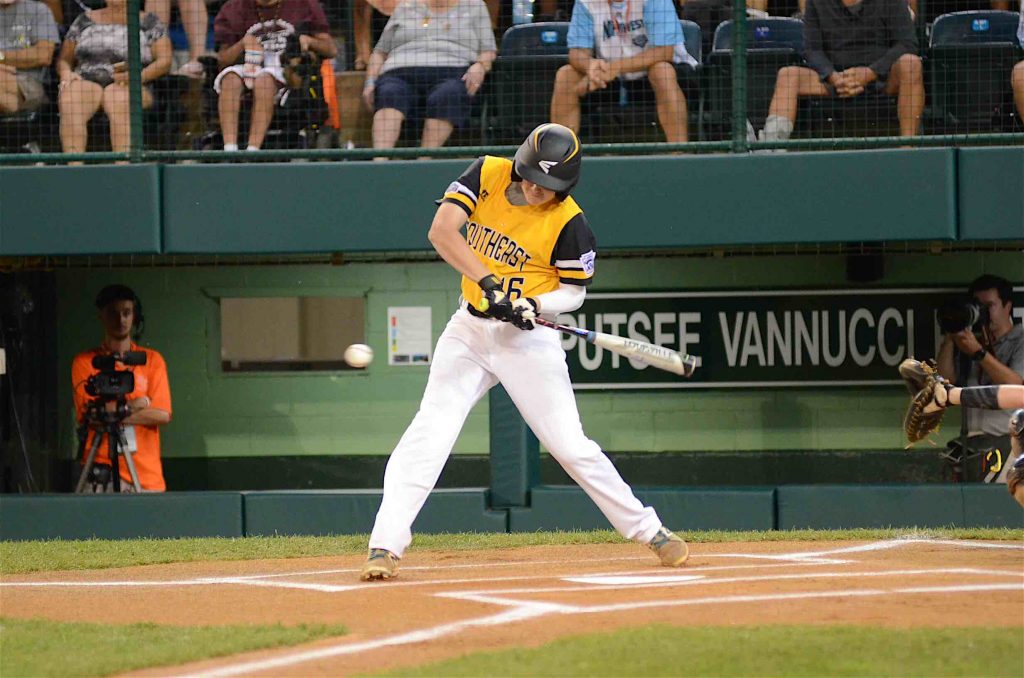 Peachtree City’s Jansen Kenty connects with a single during a Little League World Series game against the Northeast. Photo/Brett R. Crossley.