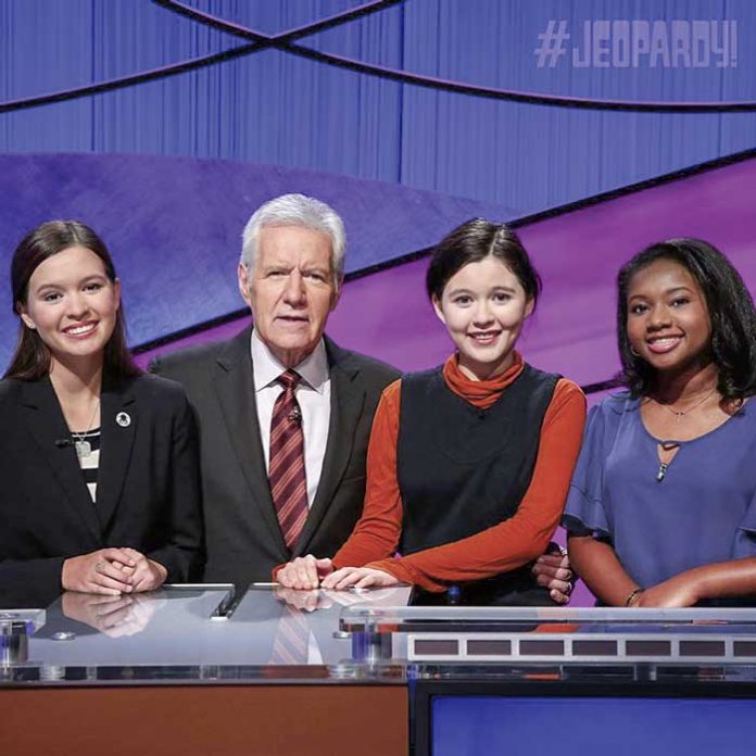 Maya Wright, far right, with her two opponents in the finals of the “Jeopardy!” Teen Tournament along with host Alex Trebek. Photo/Jeopardy.com.