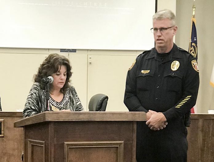 Above, the Peachtree City Council honored Lt. Mark Brown of the city’s police force for 25 years of service. Below, the city also thanked former Municipal Court Judge Steven Ott for his service. Ott will now be a juvenile judge in the Griffin Circuit. Photos/John Thompson.