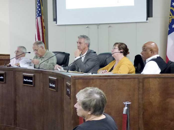 Members of the Peachtree City Planning Commission include, from left, Commissioner J.T. Rabun, Chairman Frank Destadio and commissioners Paul. Gresham, Lisa Ann Curtis and Michael Link. Photo/Ben Nelms.