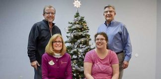 Helping to bring cheer to families with children having special needs are (front L-R) Jenny Bellamy and Chelsey Johnson; (back) Scott Johnson and Jim McCarten. Photo/Submitted.