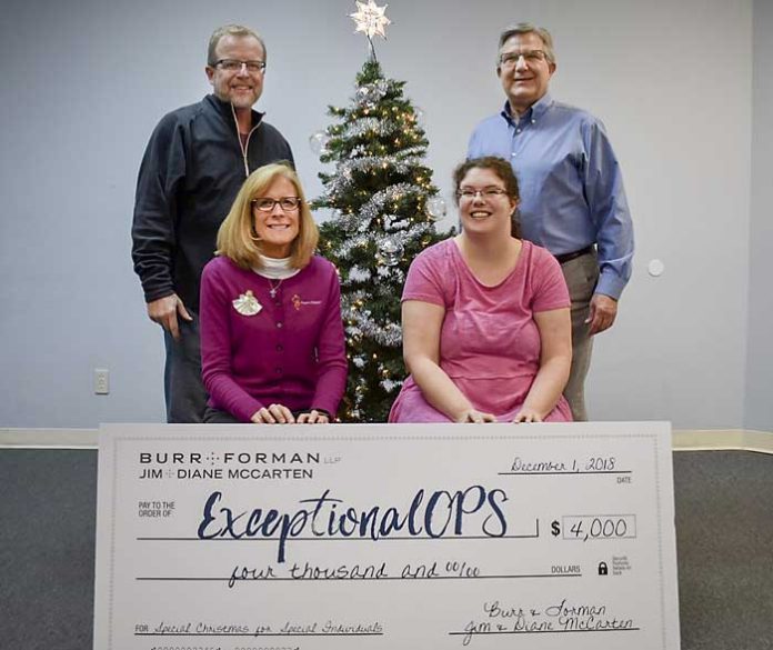Helping to bring cheer to families with children having special needs are (front L-R) Jenny Bellamy and Chelsey Johnson; (back) Scott Johnson and Jim McCarten. Photo/Submitted.
