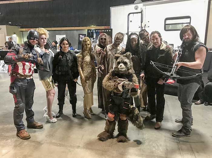 Characters from films shot at Pinewood Studios gather for a family portrait. Photo/Ben Nelms.