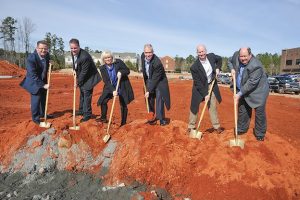 Present at the Jan. 30 groundbreaking for the new SMC3 headquarters in Peachtree City were, from left, Chief Financial Officer Tom Monheim, Chief Information Officer David Knight, Vice President of Human Resources Ruth Reynolds, President and CEO Andrew Slusher, Chief Commercial Officer Brian Thompson and Senior Vice President of Operations and Data David Walker. Photo/Mike Gibson.