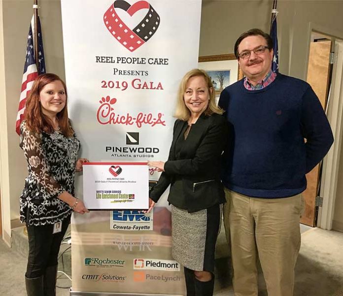 Abby Bradley (left), representing Reel People Care, celebrates the success of the organization’s winter gala with Nancy Meaders, director of Fayette Senior Services, and Dan Gibbs, FSS Director of Operations. Photo/Submitted.