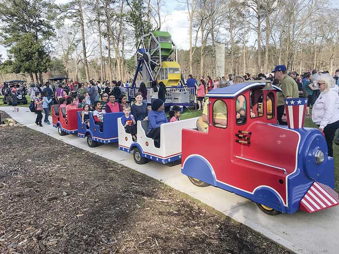 One of the many entertainments at the 60th birthday celebration was a pint-sized passenger train. In the background is a miniature Ferris wheel that stayed busy going in circles all Saturday afternoon, as well as other scenes of festive enjoyment. Photos/Ben Nelms.