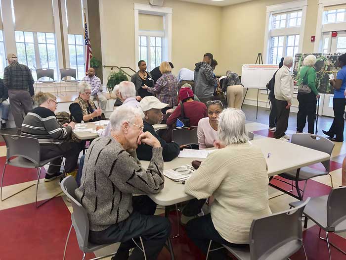 Some of the 195 county residents who attended the transportation corridor public hearing study the maps. Photo/Ben Nelms.