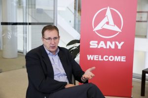 Doug Friesen, chief executive officer of SANY America, speaks during an interview with Xinhua at his office in Peachtree City, Georgia, the United States, March 29, 2019. SANY America, the U.S. subsidiary of China’s heavy construction equipment manufacturer, is to start building its brand excavators “completely from scratch” in June in the United States. Photo/Xinhua/Wang Ying.