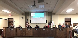 The Peachtree City Council April 18 with the public comment timer running on the screen behind them. Photo/Cal Beverly.