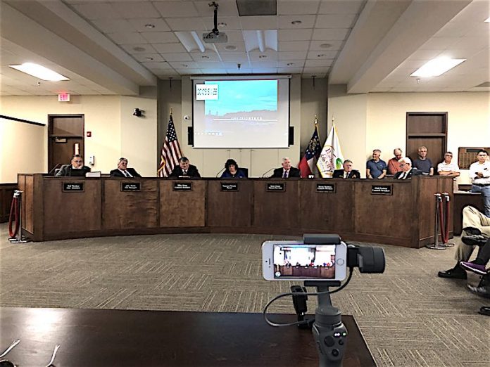 The Peachtree City Council April 18 with the public comment timer running on the screen behind them. Photo/Cal Beverly.