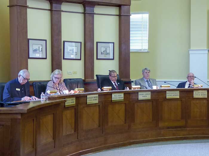 Present at the April 18 meeting of the Fayetteville City Council where two entertainment districts were approved for outdoor drinking included, from left, council members Harlan Shirley and Kathaleen Brewer, Mayor Ed Johnson and council members Rich Hoffman and Scott Stacy. Photo/Ben Nelms.