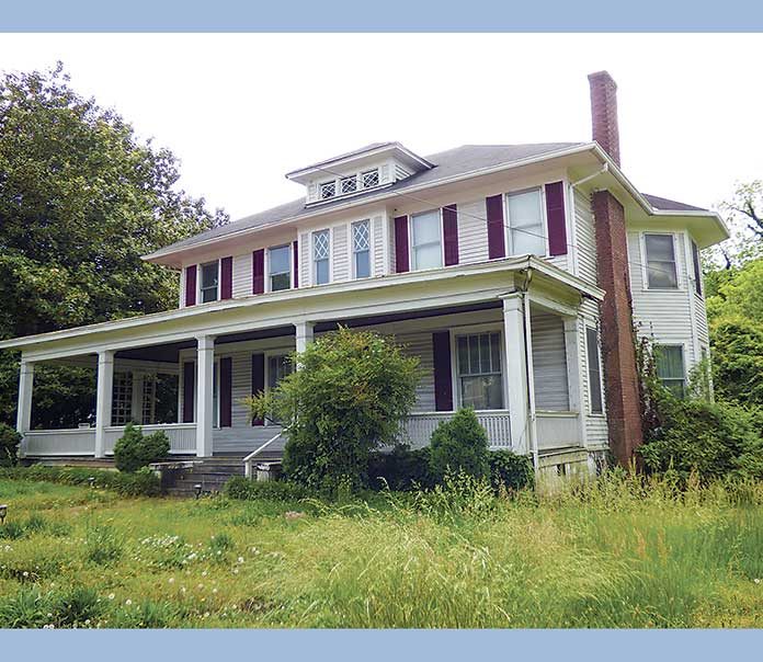 The old, vacant Redwine House in downtown Fayetteville has deteriorated to the point it cannot be used in the Meridian on the Square mixed-use development as a leasing office or for other uses. Elements of the house will be maintained for display in Meridian’s community room. Photo/Ben Nelms.