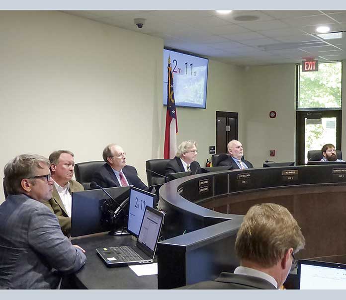 Present at May 20 meeting of the Fayette County Board of Education were, from left, board members Brian Anderson and Barry Marchman, Superintendent Jody Barrow, Chairman Scott Hollowell and board members Roy Rabold and Leonard Presberg. Photo/Ben Nelms.