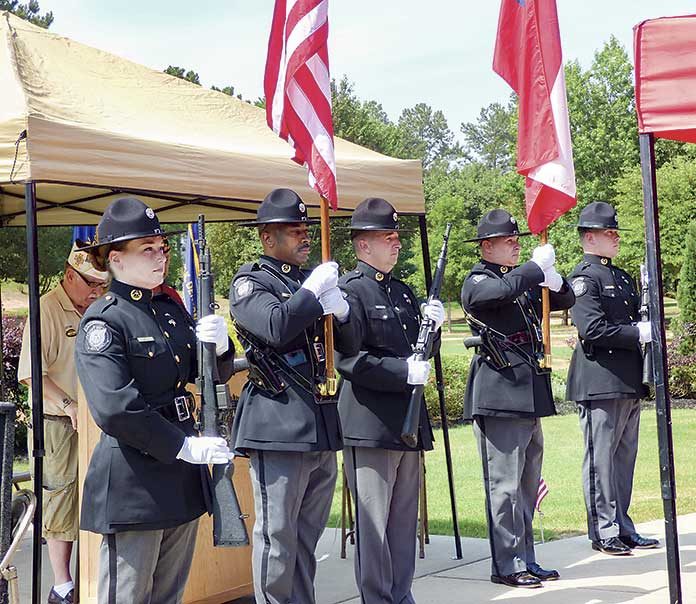 The Fayette County Sheriff’s Office Color Guard presented the colors at the Memorial Day ceremony held at Patriot Park in Fayetteville. Photo/Ben Nelms.