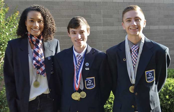 Pictured, from left, are DECA International Career Development Conference top 10 winners McKenzie McManaman, Matthew Moore, and Mason Rzepkowski. Photo/Fayette County School System.