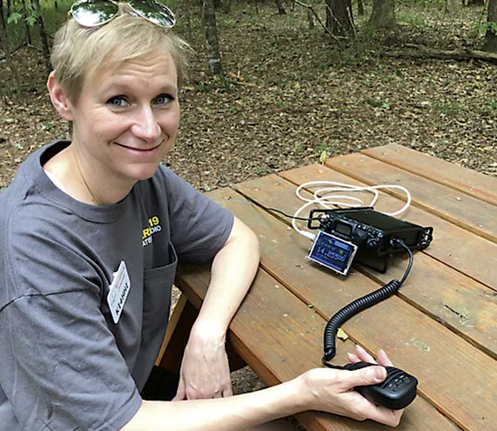 Mary Catherine Domaleski (KI4HHI) talks to a remote station in Delaware using Amateur (Ham) Radio in preparation for Field Day. Photo/Joe Domaleski (KI4ASK).