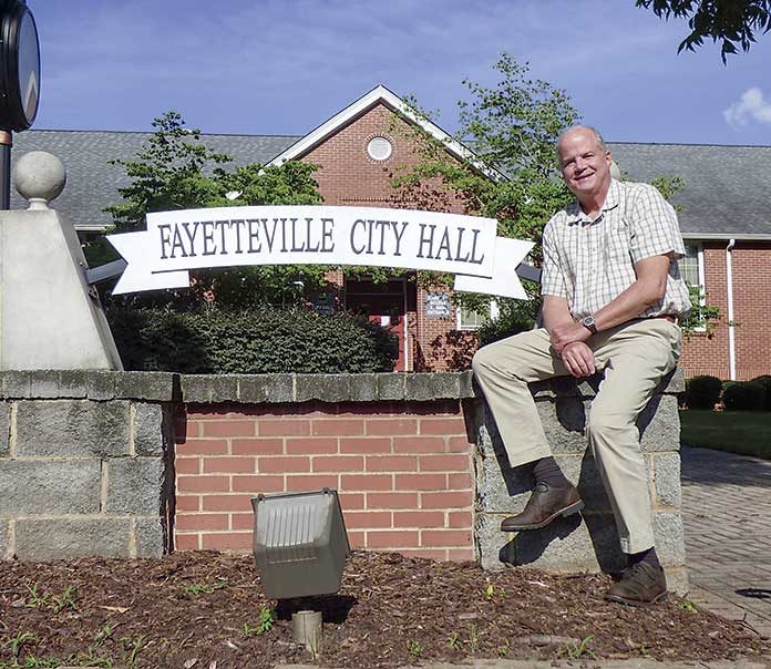David Rast in front of Fayetteville City Hall. Photo/Ben Nelms.