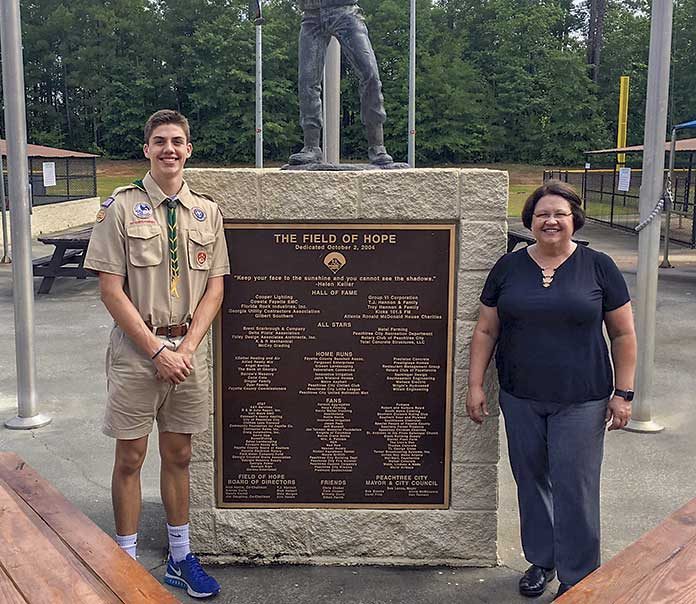 Jack Tucker presented newly constructed picnic tables for the Field of Hope to Quinn Bledsoe, director of Peachtree City Recreation and Special Events, recently. Photo/Submitted.