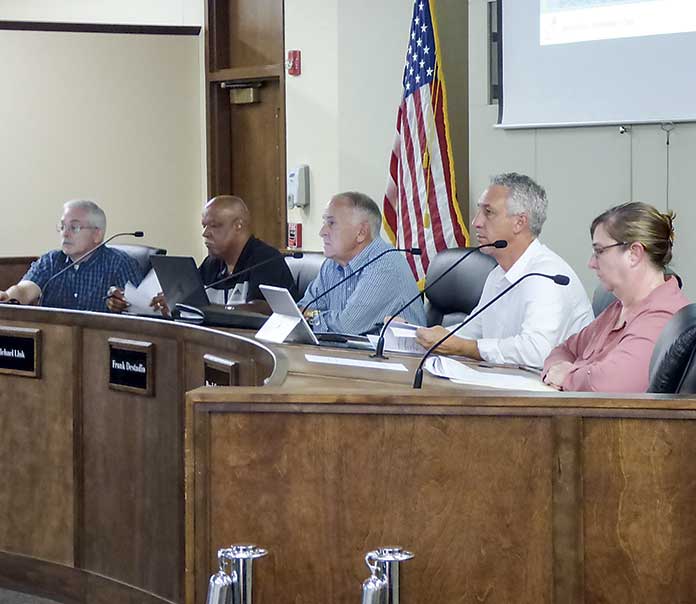 The Peachtree City Planning Commission on July 8 listen to a preseentation. Pictured, from left, are commissioners J.T. Rabun and Michael Link, Chairman Frank Destadio and commissioners Paul Gresham and Lisa Ann Curtis. Photo/Ben Nelms.