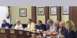 Pictured at the July 18 meeting, from left, are council members Harlan Shirley, Kathaleen Brewer and Paul Oddo, Mayor Ed Johnson, council members Rich Hoffman and Scott Stacy, City Manager Ray Gibson and City Clerk Anne Barksdale. Photo/Ben Nelms.
