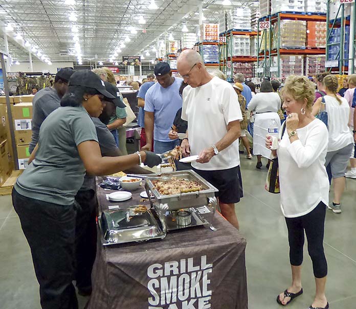 <b>Customers line up for grand opening taste treats at Costco. Photo/Ben Nelms.</b>