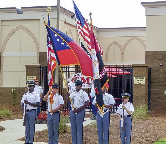 The Georgia Military College Color Guard posts the colors and the Marine Corps League, Maj. Stephen W. Pless Detachment 1196, at rear, raises Old Glory at the Aug. 20 grand opening of GMC’s Phase 2 expansion in Fayetteville. Photo/Ben Nelms.