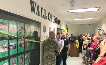 The McIntosh High School Wall of Honor honoring former students, faculty and staff who served in the military was unveiled on Sept. 6 before a wealth of visitors. Photo/Ben Nelms.