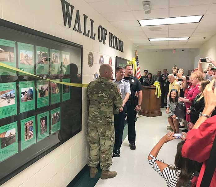 The McIntosh High School Wall of Honor honoring former students, faculty and staff who served in the military was unveiled on Sept. 6 before a wealth of visitors. Photo/Ben Nelms.