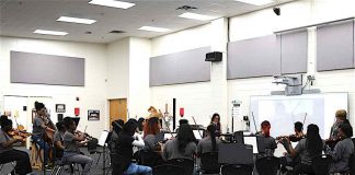 Fayette County High School Orchestra students perform for composer. Photo/Fayette County School System.