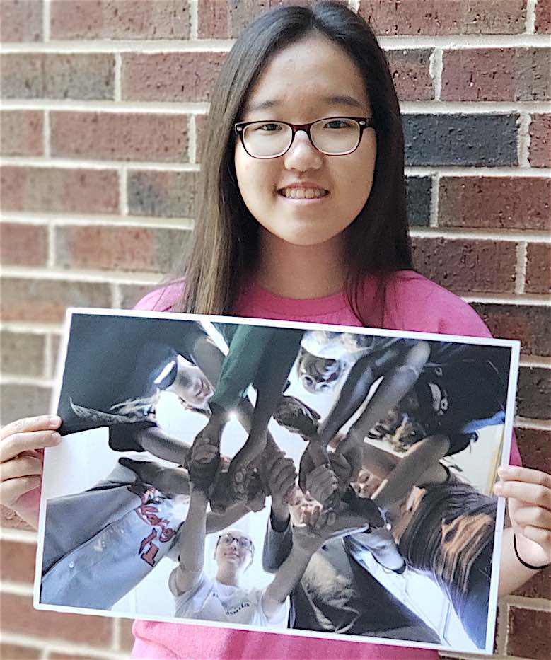 <b>Below, MHS Student Media GSPA Photo Contest winners, holding their winning entries. Photos by Shanon Woolf.</b>