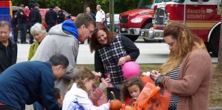 Pumpkin painting was just one of the many activities at the Public Safety Fall Festival, held Oct. 18 at the Fayette County Justice Center. Photo/Ben Nelms.