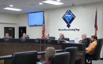 The Fayette County Board of Education on Nov. 4 voted 4-1 to build a $46 million replacement school for Booth Middle School in Peachtree City. Pictured, from left, are board members Brian Anderson and Barry Marchman, Superintendent Jody Barrow, Chairman Scott Hollowell, and board members Roy Rabold and Leonard Presberg. Photo/Ben Nelms.